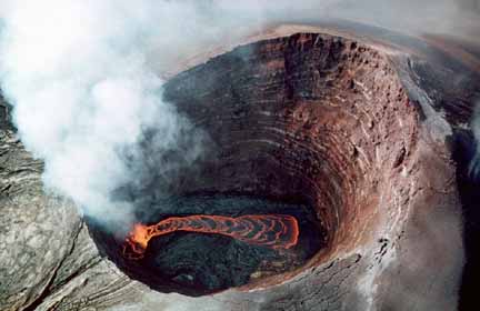 photo 077.  Aerial photo taken looking down the throat of a lava vent with red-hot lava flowing on bottom