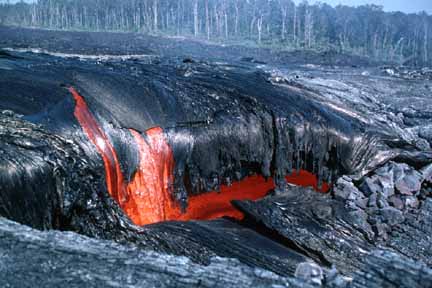photo 091.  Photo of crusted-over lava flowing over ledge, some red-hot lava showing through torn-away crust