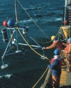 Photograph of a bottom tripod system being deployed for U.S. Coast Guard Cutter.