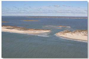 Thumbnail image of aerial photograph of the new breach on the eastern end of Fire Island, New York, taken 5 days after Hurricane Sandy, October 2012; links to report