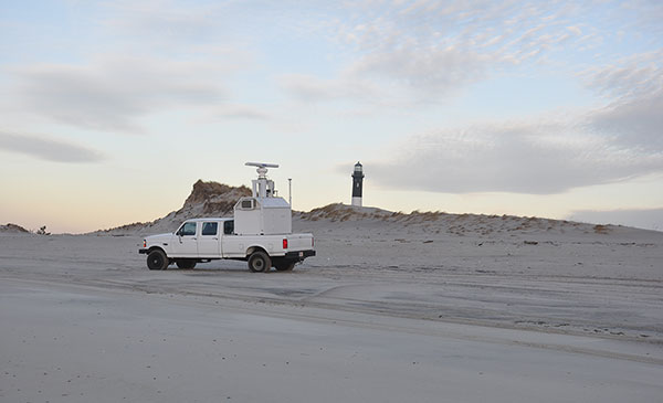U.S. Army Corps of Engineers survey vehicle collecting ground-based lidar along the upper beach near Fire Island Lighthouse on Fire Island, New York.