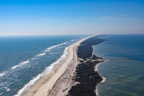Coastal oblique aerial photograph looking southwest along Fire Island, New York, March 2016