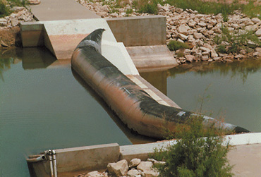 B. Photograph showing water-control structure in Area VIII.