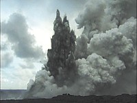 An explosion throwing hot lava spatter and rocks.