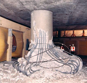 photograph of a severely damaged, non-retrofitted overpass after an earthquake