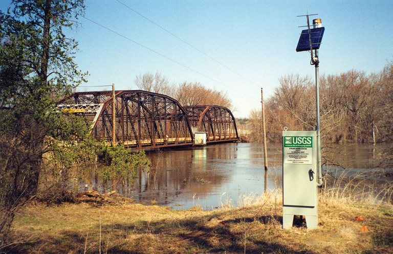 Photograph showing USGS Minnesota automated stream gage during 2001 spring flood. Gage sends data back to USGS site via satelite and data is accessable to public by a continuously updated Web page.
