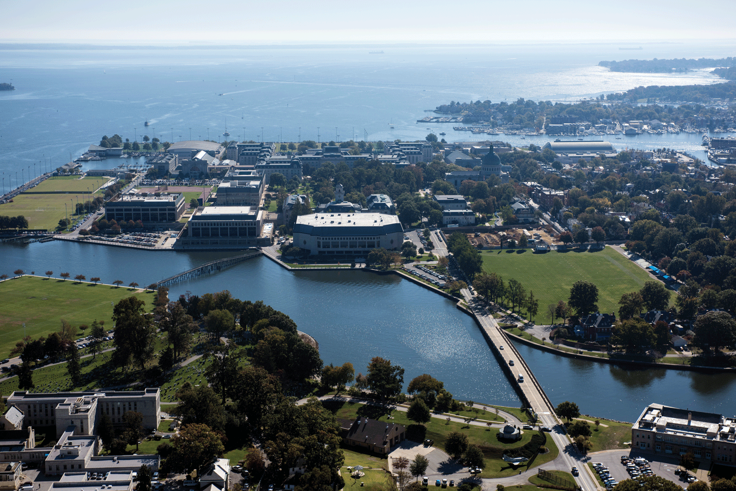 The U.S. Naval Academy is located along the Chesapeake Bay in Annapolis, Maryland.
                        The campus has taken measures to minimize flooding damages, but in high-tide flooding,
                        Ramsay Road routinely floods. Photograph credit: U.S. Naval Academy. 