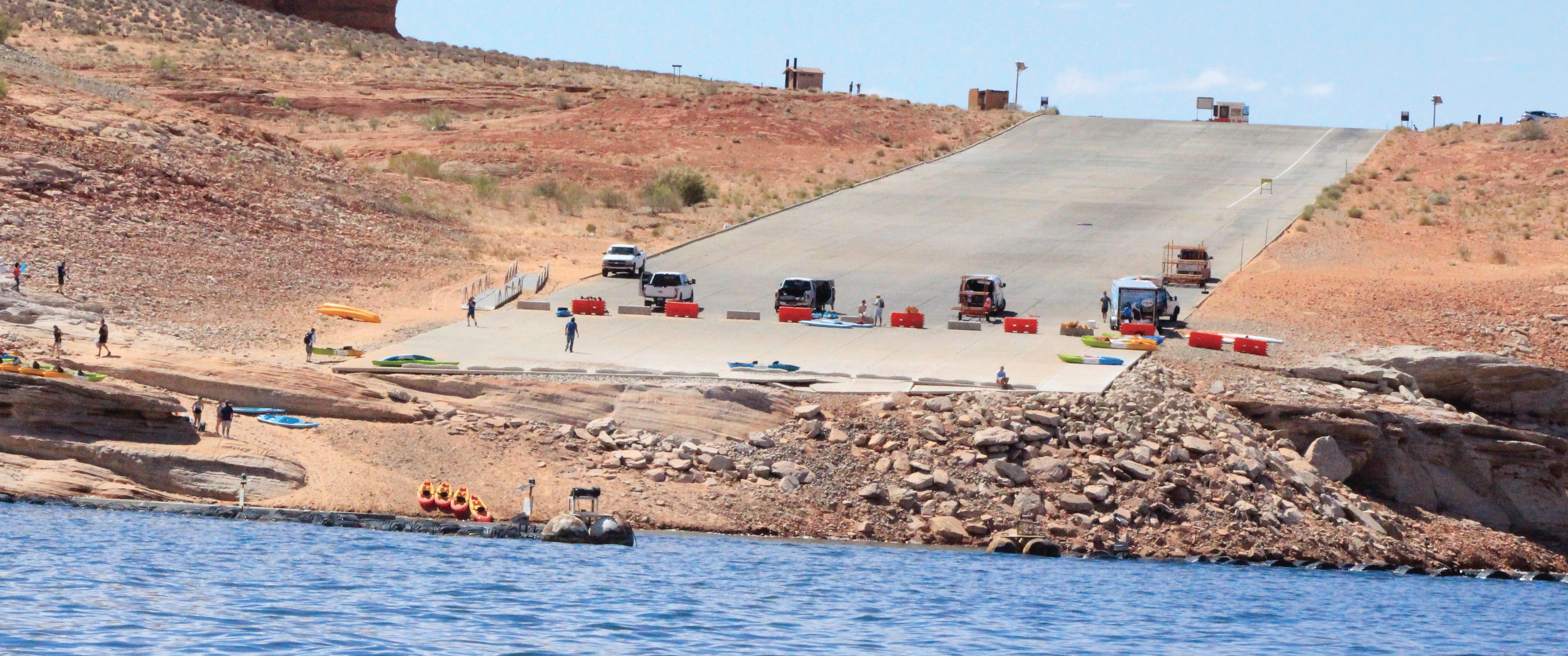 Image showing the Antelope Point public launch ramp in Arizona, shown here in June
                     2021, is closed to motorized vessels because of the low water level on Lake Powell,
                     but kayakers can still use the ramp.