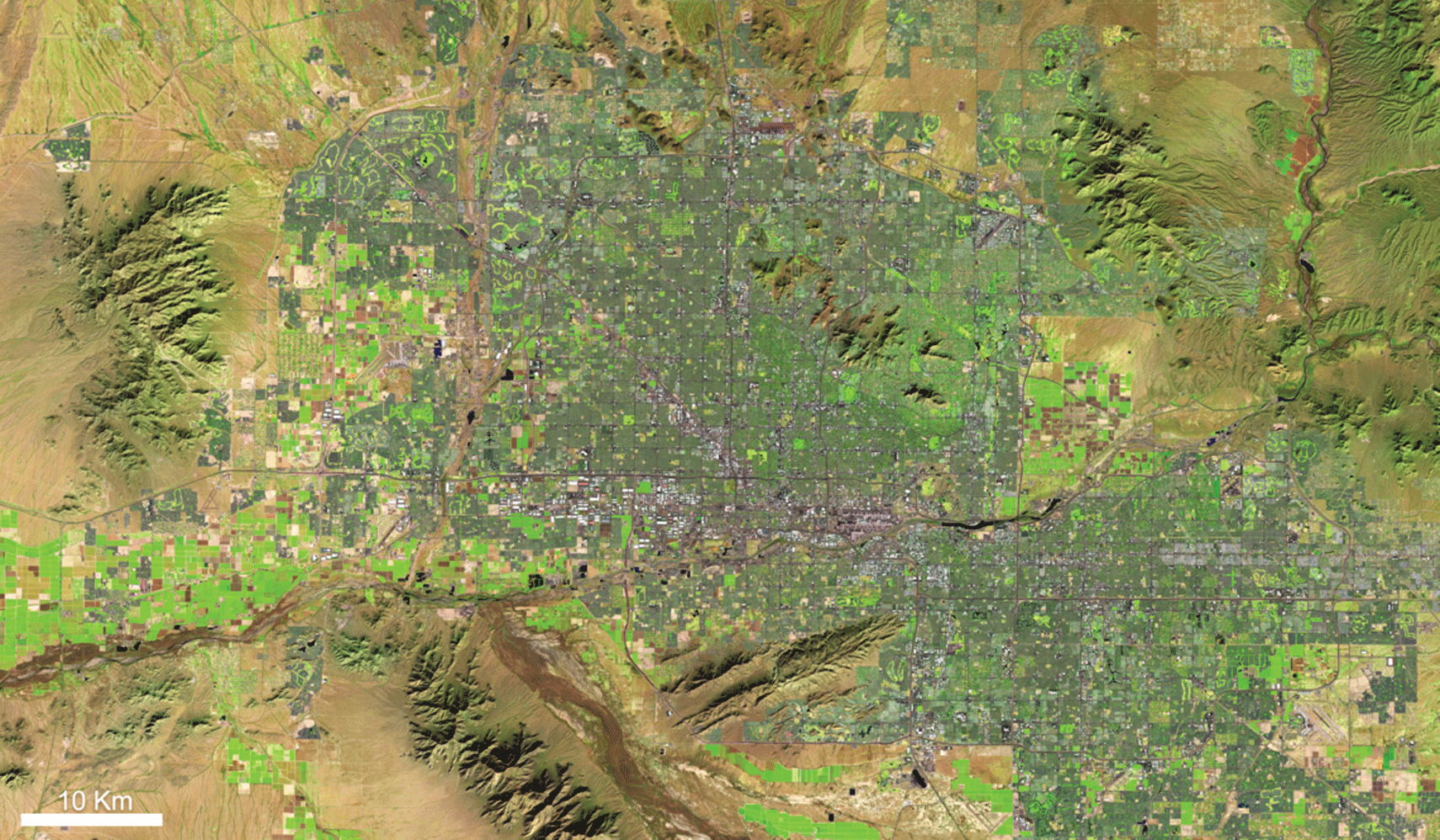 Image showing as Phoenix continues to grow, Landsat data can show planners and managers
                     how incorporating trees, grass, and shrubs can lower temperatures and water consumption
                     in these growth areas.