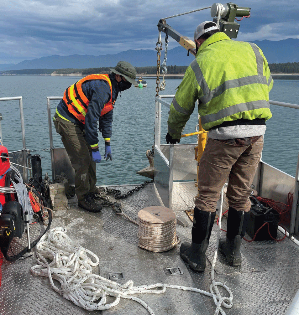 Two men on a metal boat.