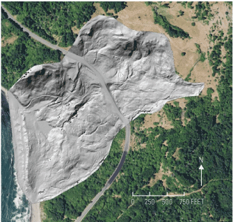 The landslide covers much of the image, with U.S. Route 101 curving through it. Forest
                     is to its northwest and southeast.