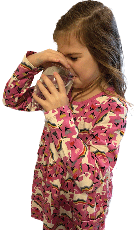 The girl is pinching her nose in disgust as she drinks the water