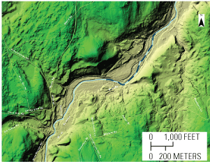 The South Branch Piscataquog River winds through rugged terrain. The ice jam extended
along a half-mile stretch of the river where the flood plain width ranges from very
narrow to almost 1,000 feet.