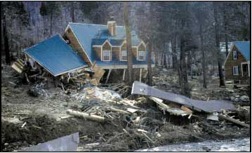 Homes destroyed by a sudden catastrophic landslide in 1997 along U.S. Highway 50