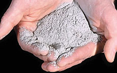 photograph showing volcanic ash from the 1980 Mount St. Helens in someone's hand