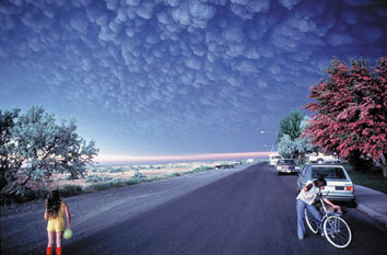 photograph showing a large cloud of volcanic ash from Mount St. Helens approaching the town of Ephrata, Washington
