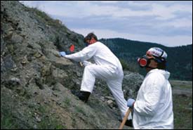 Photograph of Figure 3. USGS scientists collecting soil samples at Libby, Montana, to check asbestos content