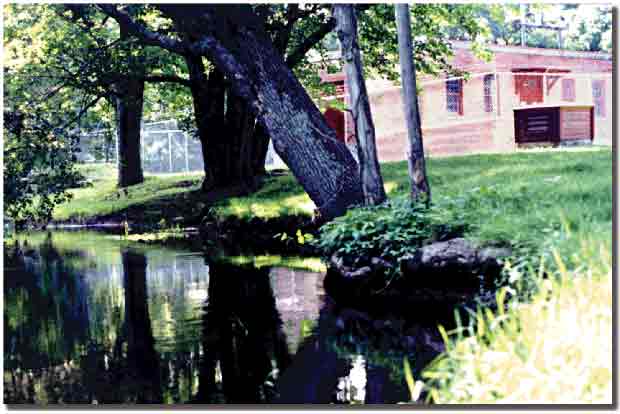 A photograph of a water-supply well house near the Hunt River, East Greenwich, Rhode Island