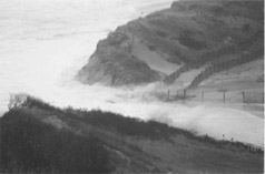 Photo of storm surge breaching barrier dune