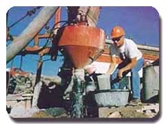 A color photograph of a man working around heavy machinery. Photo: USGS