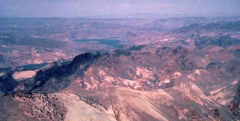 Photograph of caldera with volcanic hills in background