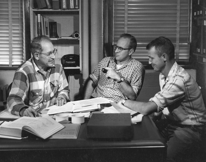Dr. Kenneth O. Emery (left), in charge of the joint WHOI-USGS project, Geological Studies of the Atlantic Continental Shelf and Slope, confers with Dr. Robert H. Meade, USGS (center) and Dr. John S. Schlee (right).