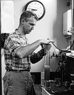 Dr. John S. Schlee, USGS, separates the pulverized sediments into a graduated cylinder.