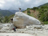 Large (11.3 x 5.0 x 3.5 m) sub-rounded gneissic boulder deposited in center of channel