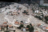 Aerial view of debris-flow deposition resulting in widespread destruction 