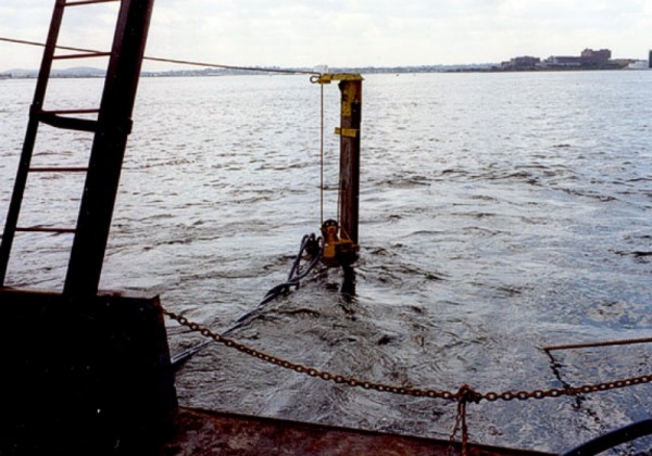 Vibracorer taking a core in shallow water.