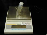 Weighing vial, liquid, and cap; link to larger image