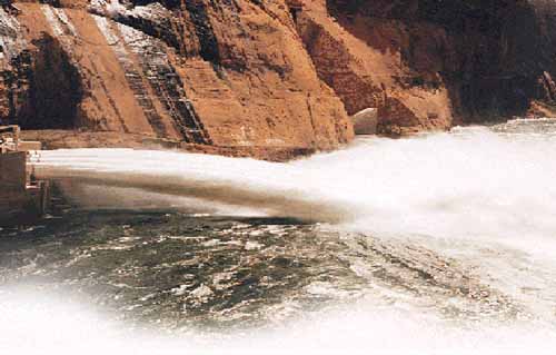 photo of water discharging from Glen Canyon Dam, 1996