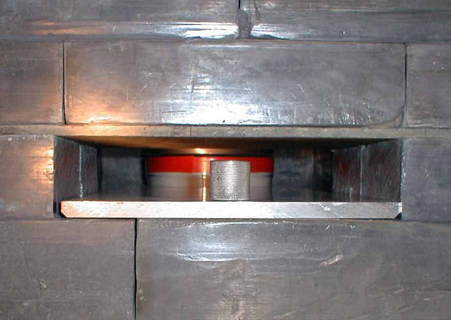 Photo looking inside of castle showing sample holder with sample container in place directly beneath detector.