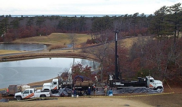 Boart Longyear sonic drilling rig and support vehicles at a wellsite on the grounds of Ballymeade Country Club, Falmouth, MA.