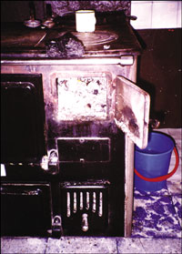 Photograph showing rural use of coal in a stove at a ranch near Rio Turbio