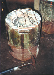 Photograph showing a coal briquette burner
