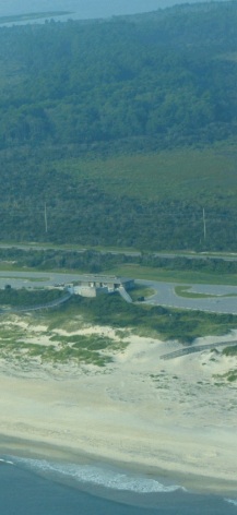 Figure 3.  Coquina Beach with Bodie Island Lighthouse in the background. Coquina Beach is ranked as very high vulnerability based on geomorphology. 