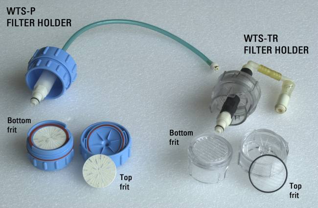 Figure 5. A view of the two types of filter holders used on the McLane Water Transfer Systems. Prior to use, the top frits are removed from both types of filter holders.