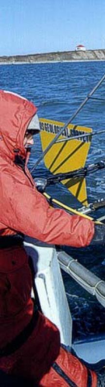 Image shows USGS and Connecticut DEP scientists deploying a modified Van Veen grab sampler in Long Island Sound. This sampler is equipped with both still and video cameras.