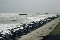 Revetments and segmented breakwaters constructed to protect the western Louisiana coastal highway from storm waves and beach erosion.