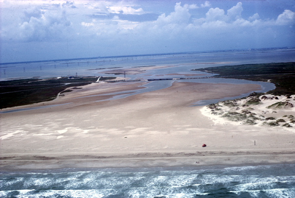 Complete overwash only occurs at a few sites where storm-surge channels cut through the dune ridge.