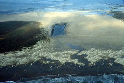 Complete overwash is common along South Padre Island where storm-surge channels cut across the island.