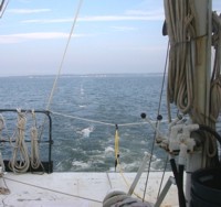 Thumbnail image for Figure 3, photograph of CRP streamer being towed behind the survey vessel and link to larger image.