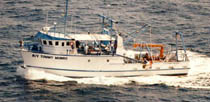 Thumbnail image of figure 3, photograph of R/V Tommy Munro underway, and link to larger figure.