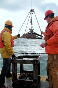 Thumbnail image for Figure 8, A photograph of USGS employees deploying the grab sampler.