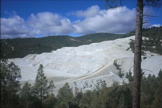 Thumbnail of an asbestos mine and link to report PDFs