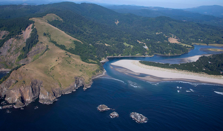Aerial view of the Salmon River Estuary exiting into the Pacific Ocean 