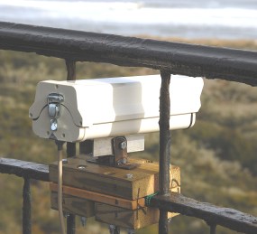 Thumbail image for Figure 9. Video camera system was mounted on the railing at the top of the Cape Hatteras Lighthouse.
