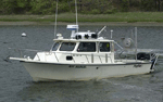 Thumbnail image of figure 7 and link to larger figure. Photograph of the boat used to collect samples and photography in the study area.