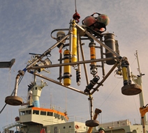 Thumbail image for Figure 3, image of Minipods deployed at sites 1 and 2 with instrumentation to measure the seabed surface and current velocity profiles, and link to full-sized figure.